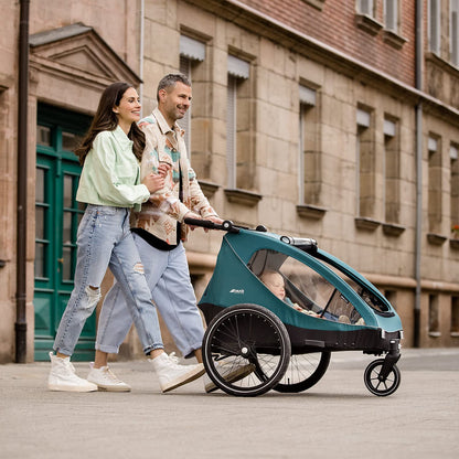 hauck Fahrradanhänger & Kinderwagen Dryk Duo Plus mit Federung, für 2 Kinder (6-48 Monate), inkl. Deichsel, Buggyrad, Fahne und LED Licht, Faltbar, Höhenverstellbar, XL Kofferaum (Dark Green)